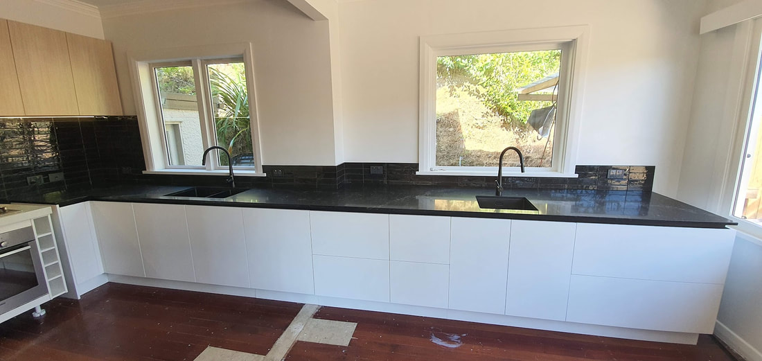 Handless kitchen with negative-detail benchtop, Wellington